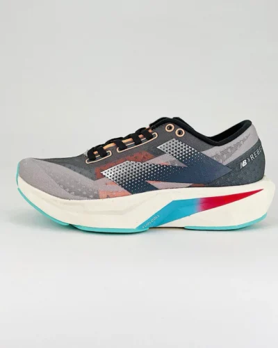 New Balance SC Elite V4 Sneakers In Grey, Rose Blue And Red